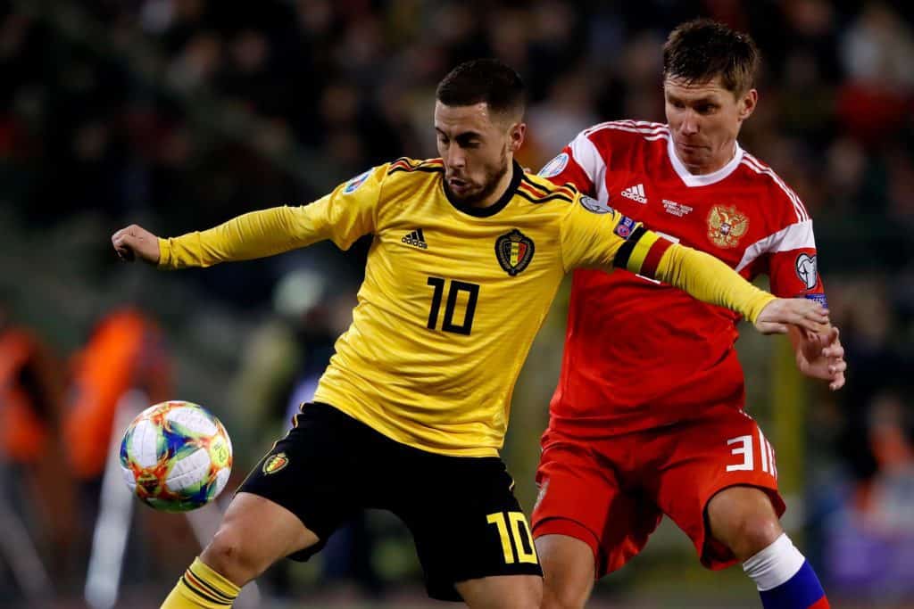 The excitement is building as Group B gets started. Group B consistest of Belgium, Denmark, Finland, and Russia. Today, Belgium faces Russia at the Krestovski Stadium in Saint Petersburg to matchday 1 of Group B. The Belgians are the favorites to win, leaving the Russians and the Danes to fight for second place, while the Finns seek to surprise and place among the best 16 teams. How do Belgium and Russia arrive? The Red Devils of Belgium start this European Championship as one of the three favorite teams to lift the cup and France and England. The Belgian national team is led by superstars Kevin De Bruyne, Eden Hazard, and Romelu Lukaku, who will start their way against Russia, who could surprise him if they are neglected at any time. This may be the last chance to win in a tournament against teams of this caliber for Belgium. These world stars are already beginning to show their age, which is why they are no longer the young and fearsome selection of a year ago. Belgium is coming off defeating Croatia in its penultimate preparation match with a close score of 1-0 in a friendly match. In the second and last preparation match, Belgium drew 1-1 against the Greek team. Next, you will enjoy the best moments of the last match played by Belgium: https://www.youtube.com/watch?v=H0qCl2pAeXA (Video courtesy of www.youtube.com and the YouTube channel TNT Sports Brasil) On the other hand, we have the Russian team, which is currently in a period of football renewal and does not have any world-class players to face this Eurocup, but, in the same way, they can surprise because other teams may take them for granted. Their aspirations are minimal, so advancing to the next round in this tournament would be an excellent entry for the Russians. This first home game can provide them with extra motivation, although Belgium is far above them, footballing speaking. Another point to note is that Russia has only managed to win 3 of its last 11 games. Russia comes from drawing against the Polish team 1-1 and defeating Bulgaria 1-0 in their previous two preparation matches. Next, you will enjoy the best moments of the last match played by Russia: https://www.youtube.com/watch?v=hPLu1bMenxE (Video courtesy of www.youtube.com and the YouTube channel FIFA WOLRD CUP 2022) Important game data ü When is it? The game will be on Saturday, Jun 12, 2021 ü What time is it? The game starts at 15:00 hours ET ü Where? Krestovski Stadium in the city of St. Petersburg, Russia. ü Where can I see it? ESPN, TUDN Radio, Sky, TSN, CTV. Betting line for Belgium vs. Russia UEFA Euro 2021. The Belgian national team's first game on their way to the European Championship title is against a weak and renewed Russian team. Although they will indeed play in Russia, and after analyzing different factors of the game and the teams' squad, we can say that Belgium will have no problem in defeating Russia in this first game. Therefore, our winner token it's for Belgium. Moneyline: -123 Belgium +305 RussiaField Goals: +21/2 (+106) -21/2 (-140) Predictions Belgium: 68.9% Russia: 18.8% Draw: 19%